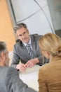 Couple signing contract at lawyer's Royalty Free Stock Photo