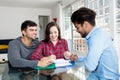 Couple signing contract for own house Royalty Free Stock Photo