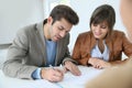 Couple signing property agreement Royalty Free Stock Photo