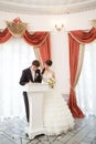 Bride and groom signing a wedding document Royalty Free Stock Photo