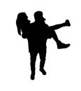 Couple silhouette. Boy holds girl in his arms. Happy couple.