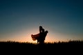 Couple silhouette dancing in the sunset