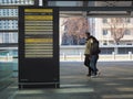 Couple silhouette walking wearing protective mask in train station