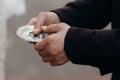 Couple of silver wedding rings on silver plate close-up in church during wedding ceremony, luxury jewelry, two rings in old man`s Royalty Free Stock Photo