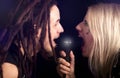 Couple singing into the microphone