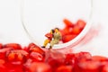 The couple sit at the edge of a glass with a glass full of heart