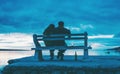 Lovers drink wine on the beach at sunset