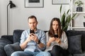 A couple is using smartphones at home Royalty Free Stock Photo