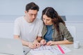 Couple talks about drawings of appartment renovation Royalty Free Stock Photo