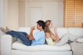 Couple sitting back to back while drinking wine Royalty Free Stock Photo