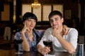 Couple sitting at the bar drinking red wine Royalty Free Stock Photo