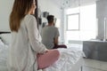 Couple Sitting On Bed Looking In Window Back Rear View Of Man And Woman Separate In Bedroom Royalty Free Stock Photo