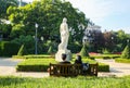 Couple is sitting on the bench near the Barcelona Montjuic castle. Beautiful park and monument