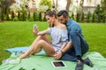 Couple sitting on the blaket, spending nice time and taking self Royalty Free Stock Photo