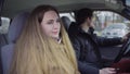 Couple sitting in car after a fight