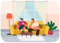 Couple sitting on couch at home in living room interior, guy and girl eating popcorn and talking Royalty Free Stock Photo