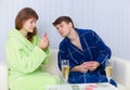 Couple sitting on couch and playing cards Royalty Free Stock Photo