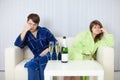 Couple sitting on couch after a quarrel Royalty Free Stock Photo