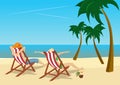 Couple sitting in deck chairs on beach at tropical resort