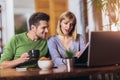 Couple sitting at the desk at home read notice paper check bills or bank account balance Royalty Free Stock Photo