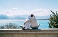 Couple sitting and enjoying the Mediterranean Sea and Antalya city harbor during their Turkish homey-moon. Romantic people Royalty Free Stock Photo