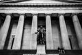 Couple Sitting in Front of Federal Building in Wall Street,. Greek Style Building in New York. Black and White Photography