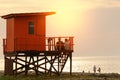 Couple are sitting on the lifeguard tower on the beach, people a Royalty Free Stock Photo