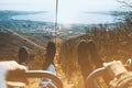 Couple sitting in lift chair of cableway. Low contrast effect