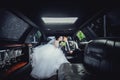 The couple sitting in the limo. Portrait of a beautiful young couple who rides around the city Royalty Free Stock Photo