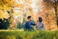 Couple is sitting on the meadow Royalty Free Stock Photo