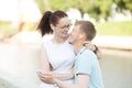 A couple sitting in the park and listening to music on the phone Royalty Free Stock Photo