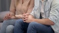 Couple sitting at psychologist, family crisis therapy, marriage counseling