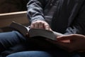 Couple sitting and reading holy Bible indoors, closeup Royalty Free Stock Photo