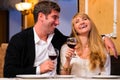 Couple is sitting at restaurant Royalty Free Stock Photo