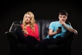 A couple sitting separately with smartphones Royalty Free Stock Photo