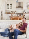 Couple Sitting On Sofa Watching Television Together Royalty Free Stock Photo