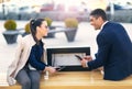 Couple sitting on solar bench Royalty Free Stock Photo