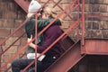 Couple sitting on stairs and embracing Royalty Free Stock Photo