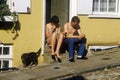 Couple sitting on stoop, Norwich, England