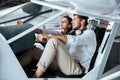 Couple sitting and talking in cabine of small aircraft Royalty Free Stock Photo