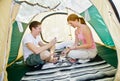 Couple sitting in tent