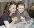 Couple sitting together laughing and happy