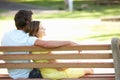 Couple Sitting Together On Park Bench Royalty Free Stock Photo