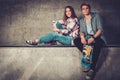 Couple with skateboard outdoors Royalty Free Stock Photo