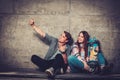 Couple with skateboard taking selfie