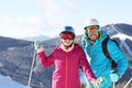 Couple with ski equipment spending winter vacation Royalty Free Stock Photo