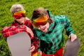 Couple in ski suit and sun glasses have a funny look to the came Royalty Free Stock Photo