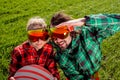 Couple in ski suit and sun glasses have a funny look to the came Royalty Free Stock Photo