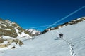 Couple on ski tour next to glacier lakes with scenic view on Hoher Sonnblick in High Tauern mountains in Carinthia, Salzburg,