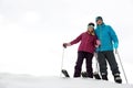 Couple of skiers on slope at resort, space for text Royalty Free Stock Photo
